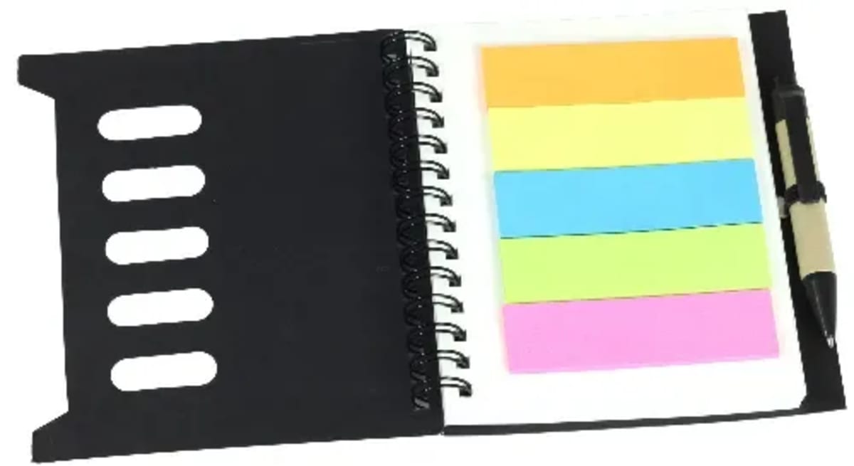 A spiral-bound notebook with a black cover is open, displaying several colored sticky notes in orange, yellow, blue, green, and pink. A pen is clipped to the edge of the notebook.