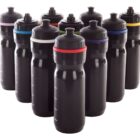 Ten black water bottles with sports caps are arranged in a semi-circle. Each bottle has a colored band near the cap, featuring red, blue, purple, yellow, green, and orange. The bottles are identical in design.