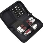 A black zippered case containing a multitool set. The case includes a multitool with wooden grips, interchangeable tool bits in elastic loops, and an additional multitool piece, all organized neatly inside.
