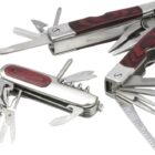 Three multi-tools are displayed with various open attachments, including knives, saws, screwdrivers, and corkscrews. They have metallic bodies with dark wood accents on the handles.