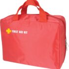 A red first aid kit with a zippered closure and two carrying handles. The words FIRST AID KIT and a yellow cross symbol are printed on the front.