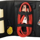 A black tool kit contains a yellow cloth, a tire pressure gauge, red jumper cables with clamps, and a black flashlight. Each item is secured in its own compartment within the kit.