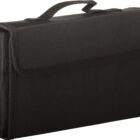 A black fabric rectangular carrying case with a handle on top and a flap closure. The case has a simple, functional design.