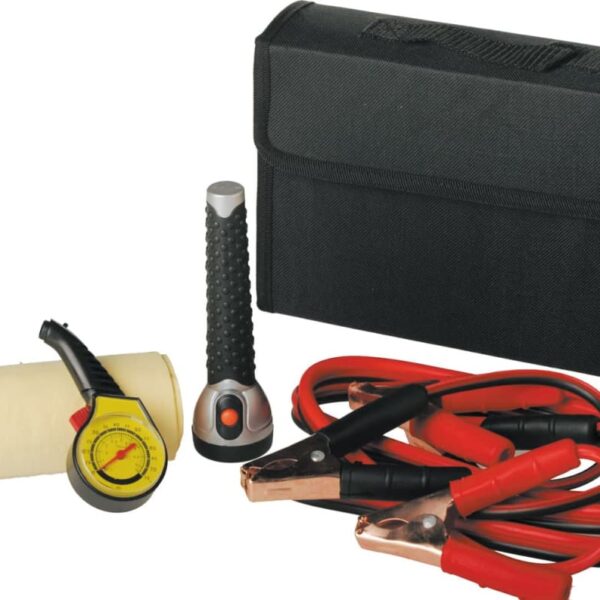 A car emergency kit containing a black bag, red and black jumper cables, a flashlight, a tire pressure gauge, and a cloth.