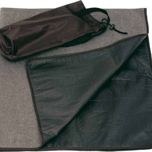 A gray, foldable picnic mat with a waterproof black underside is partially folded. A small, black drawstring pouch rests on top of the mat.