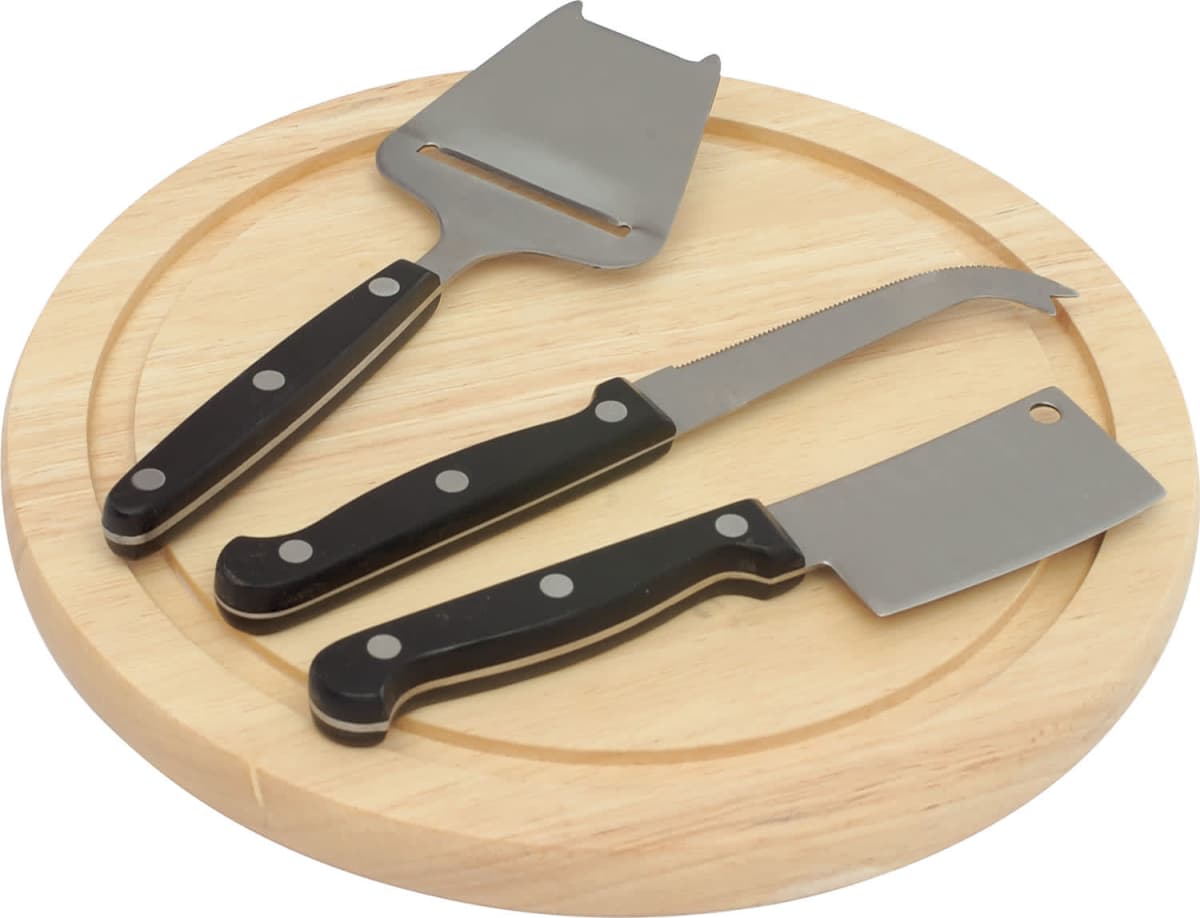A round wooden cheese board with three cheese tools: a slicer, a fork-tipped knife, and a mini cleaver. All have black handles with silver rivets.