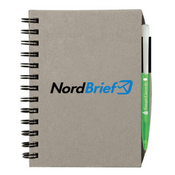 A spiral-bound notebook with a plain brown cover featuring the NordBrief logo in black and blue. A green pen labeled Smart Growth is tucked into the right side of the notebook.