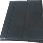 Closed black leather portfolio folder with a slightly textured surface and a subtle seam running vertically. The folder appears plain and professional, suitable for organizing documents.