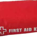A red first aid kit with a white cross icon and the words FIRST AID KIT printed on it. The bag appears to be zipped closed.