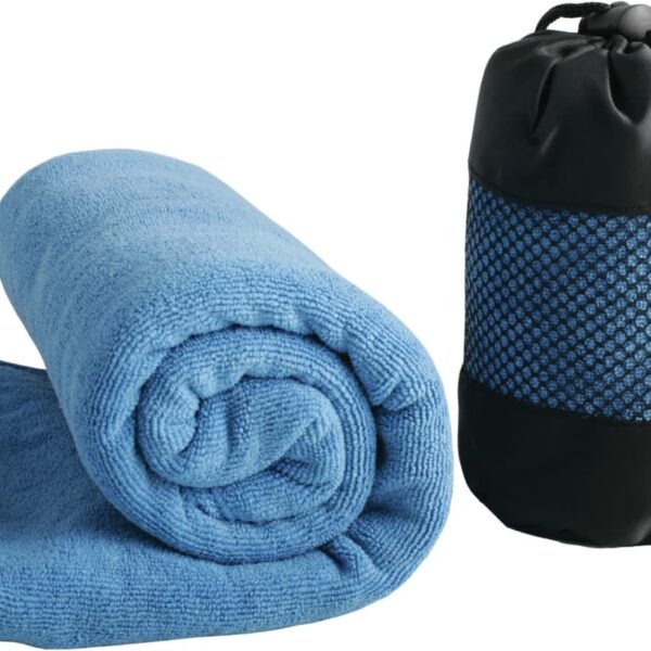 A rolled-up blue towel is placed next to a black and blue mesh storage bag with a drawstring closure against a white background. The towel and bag appear to be designed for travel or outdoor activities.