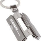 A silver metal keychain featuring a compact tool with a clip design. The tool has STEP2STEP CONSTRUCTIONS printed on it.