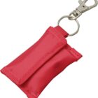 A small red fabric pouch with a flap, attached to a silver keyring and clasp. The clasp is designed for easy attachment to bags or keychains. The pouch appears compact and portable.