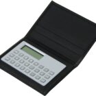A slim, portable calculator enclosed in a black folding cover. The calculator features a standard numeric keypad and a small display screen, with function buttons including memory and basic arithmetic operations. The cover has card slots.