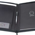 A black open portfolio folder with a pen in the center. The right side holds a notepad with the orso logo. The left side has two small pockets with orso business cards. The folder is zippered and has an additional pocket.