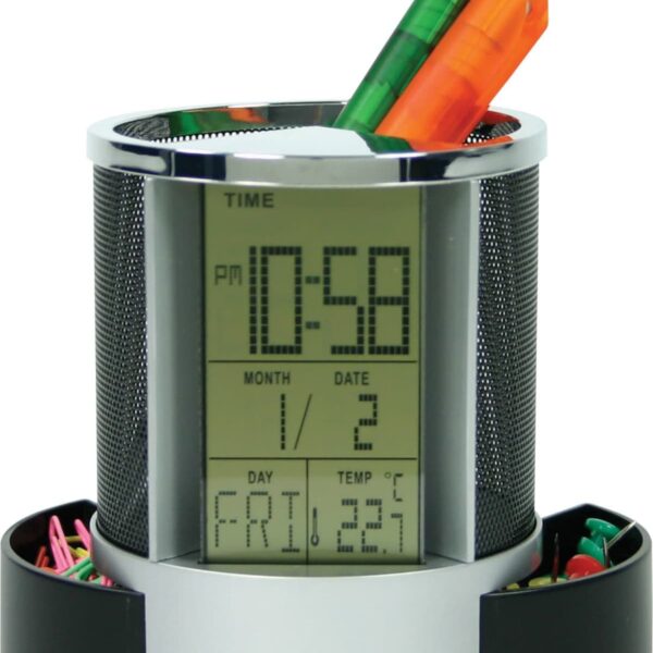 A digital desk organizer with a clock display showing 10:58 PM, date as January 2, and day as Friday. It has two compartments for stationery, holding colorful pens, and a base storing paper clips and push pins.