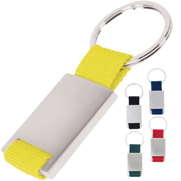 A keychain with a silver rectangular metal tag attached to a yellow fabric loop. Next to it are four smaller keychains with metal tags and fabric loops in black, red, blue, and green.