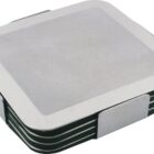 A stack of square coasters with metal edges and black centers, neatly aligned on top of each other. The coasters have a modern, minimalist design with rounded corners.