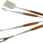 Set of three barbecue grilling tools with wooden handles: a spatula with a bottle opener, a pair of tongs, and a fork. All tools are laid out against a plain white background.