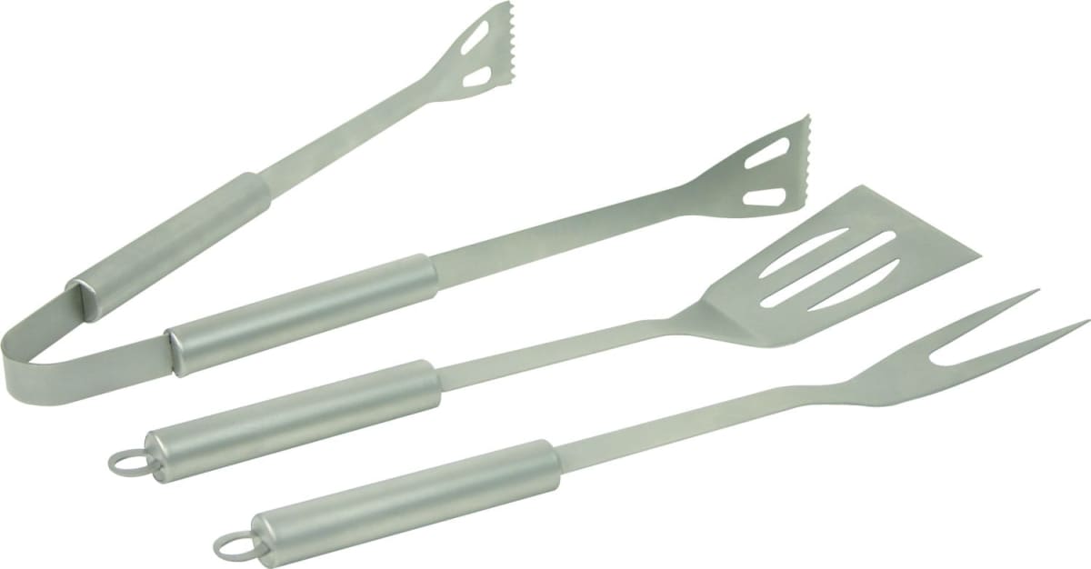 Three stainless steel barbecue tools are laid out: tongs, a fork, and a slotted spatula. Each tool has cylindrical handles and hanging loops.