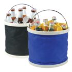 Two fabric coolers: one black, one blue. The black cooler holds bottles of beer on ice. The blue cooler contains bottles of soda with sliced oranges. Both have metal handles and beige rims.