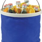A collapsible blue bucket filled with several green glass soda bottles with red caps and sliced orange wedges. The bucket has a metal handle and a cream-colored rim.