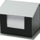 A novelty notepad holder shaped like a small house. The holder is black and silver, with a slanted roof. A stack of white notepad paper is visible through an open slot in the front.