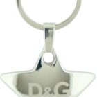 A silver star-shaped keychain with D&G engraved in the center. The brand name Dolce & Gabbana is also inscribed underneath the logo. It is attached to a simple, round metal key ring.