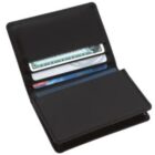 An open black wallet displaying a dollar bill in the top slot and several credit cards in the slots below.