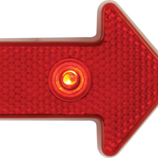 A red illuminated arrow sign pointing to the right, featuring a reflective textured surface and a central glowing light.