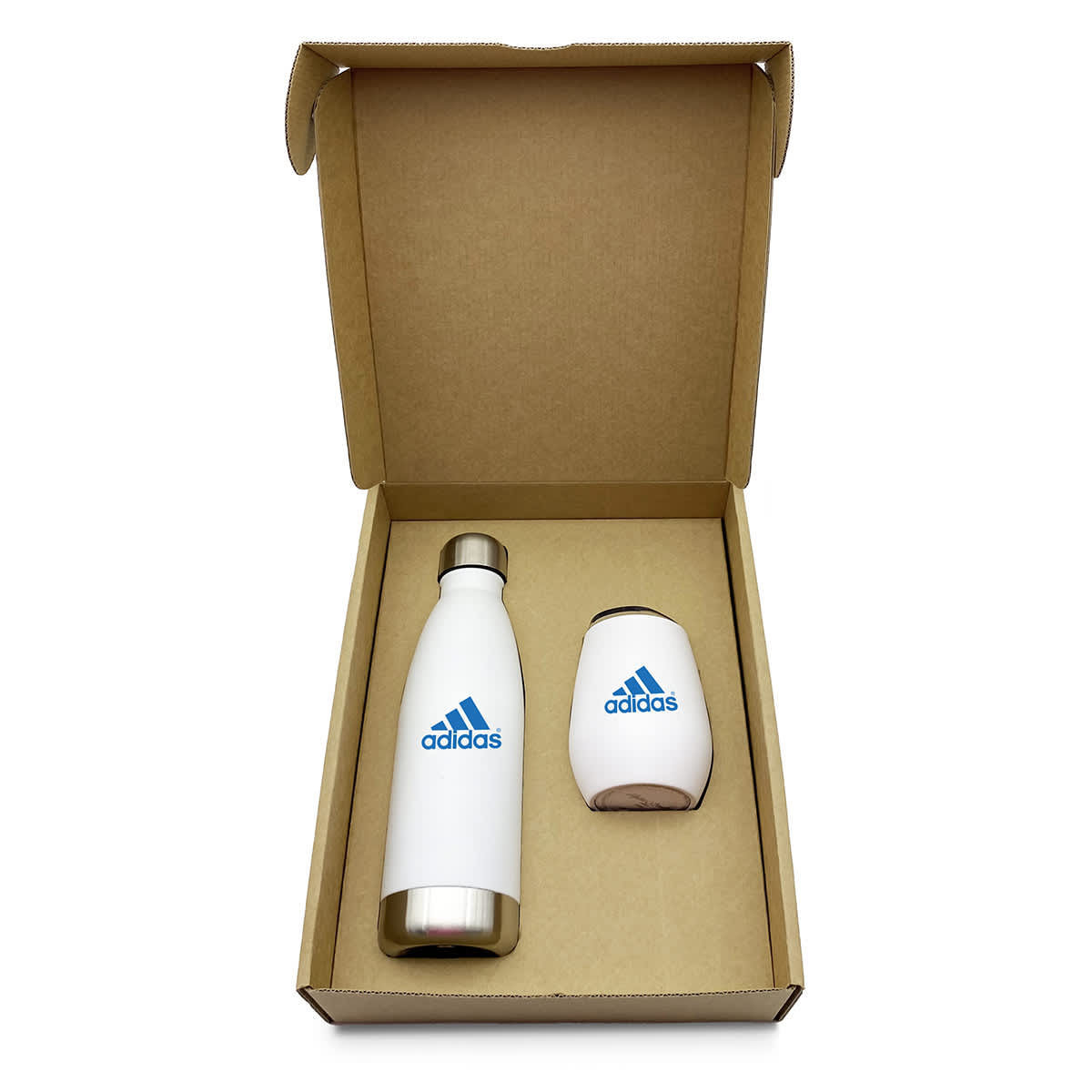 Open cardboard box containing a white insulated bottle and a white cup, both with a blue Adidas logo. The bottle has a stainless steel cap. The boxs interior is plain and unlined.
