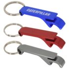 Three metallic bottle opener keychains are arranged vertically. The top opener is blue with CATERPILLAR written on it. The middle one is red, and the bottom one is silver. Each has a keyring attached.