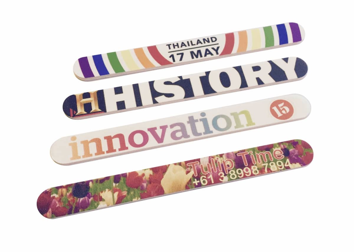 Four colorful bookmarks with various designs: one with Thailand 17 May, another saying HISTORY, the third with innovation 15, and the last featuring Tulip Time with a phone number, over a floral background.