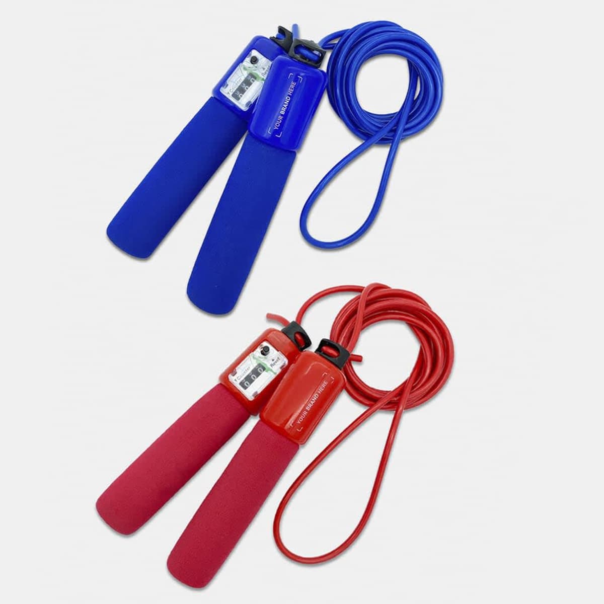 Two jump ropes are shown against a white background. One is blue with blue handles, and the other is red with red handles. Each handle features a small digital counter display. The ropes are coiled neatly.
