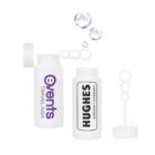 Two white bubble solution bottles with open lids. One bottle has EVENTS TRAVEL ASIA on it, and the other has HUGHES AIRCRAFT COMPANY. Each has a bubble wand with three circles. Three bubbles float above them.