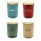 Four colored jars with wooden lids, each featuring a logo: a blue jar with a star logo, a red jar with Old Spice, a green jar with a circular logo, and a beige jar with tigerair.