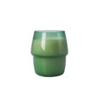A green, round glass jar containing a candle with a smooth surface, displayed against a plain white background. The jar has a subtle gradient from a darker green at the bottom to a lighter shade near the top.