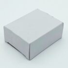 A plain white cardboard box with crisp edges, closed with no visible markings or labels, set against a light gray background.