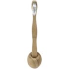 A bamboo toothbrush placed upright in a matching round holder. The toothbrush has white bristles and a smooth, natural wood finish.