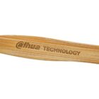 Close-up of a bamboo toothbrush handle with Dahua Technology engraved on it.