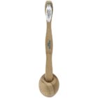 A bamboo toothbrush with white bristles stands upright in a matching circular bamboo holder. The toothbrush has a logo printed on the handle.