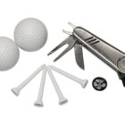 A set of golf accessories including two white golf balls, four white tees, a multifunctional silver golf tool with a brush, and a black and silver golf ball marker.