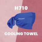 A blue cooling towel with a knot, featuring the big switch networks logo, is centered against a split pink background. The text H710 is at the top and COOLING TOWEL at the bottom.