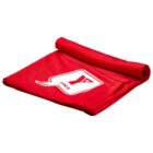 A folded red yoga mat with a rolled top edge, featuring a white speech bubble design with the word YOGA and a stylized letter Y inside.