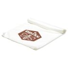 A folded white cloth with a brown hexagon logo featuring a bee design and the word apiko on it.