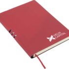 A closed red notebook lies on a white surface. It features the logo and text Helix Capital on the cover. A red bookmark ribbon is slightly visible from the bottom edge.