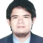 A team member in a suit with a neutral expression against a plain white background.
