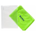 A bright green towel with AIRBUS HELICOPTERS logo lies next to a transparent plastic pouch. The towel is folded neatly, and the logo is blue with a helicopter silhouette above the text.