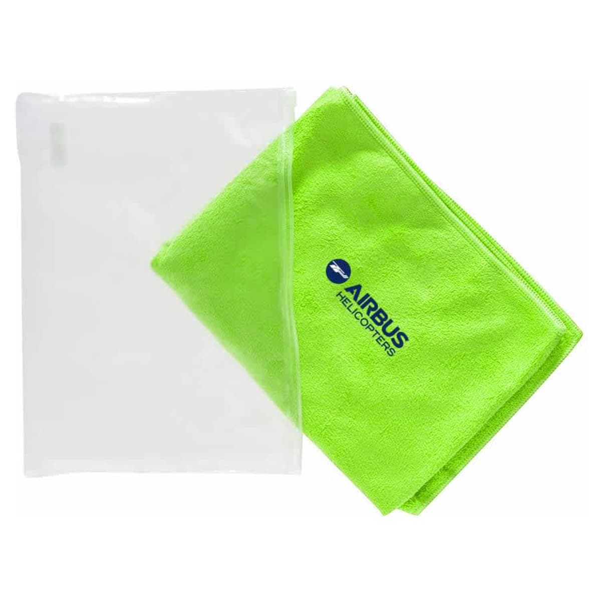 A bright green towel with AIRBUS HELICOPTERS logo lies next to a transparent plastic pouch. The towel is folded neatly, and the logo is blue with a helicopter silhouette above the text.