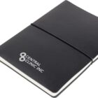 A black notebook with a white ribbon bookmark and an elastic band closure. The cover features the logo and text Central Clinic Inc. in white.