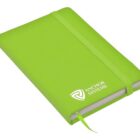 A lime green notebook with a matching elastic band and ribbon bookmark. ANCHOR SYSTEMS logo is printed on the cover. The notebook is resting on a white surface, partially open at the top.